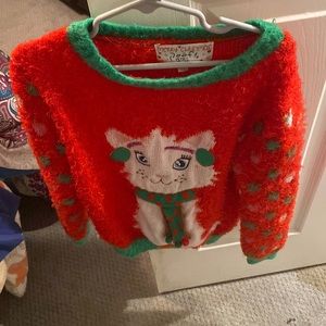 I am getting rid of a merry Christmas poof sweater size (small).